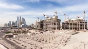 Residential developments under construction in Dubai with the city skyline in the background, illustrating off-plan property investment opportunities in Dubai in 2026.